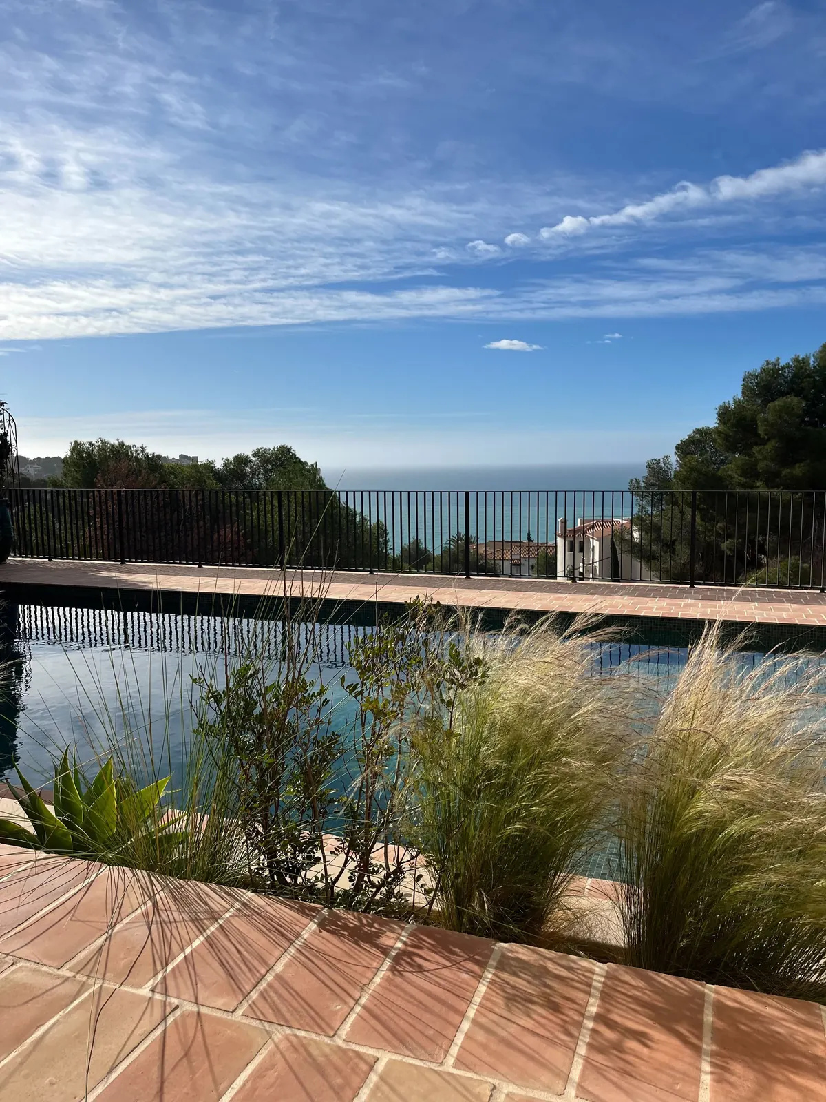 Ca L’Àmfora — terracotta terrace, grasses and a pool facing the sea