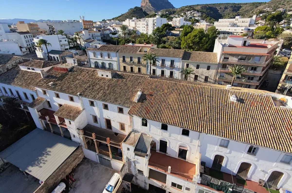 Aerial view over the rooftops of Jávea's old town towards the Montgó